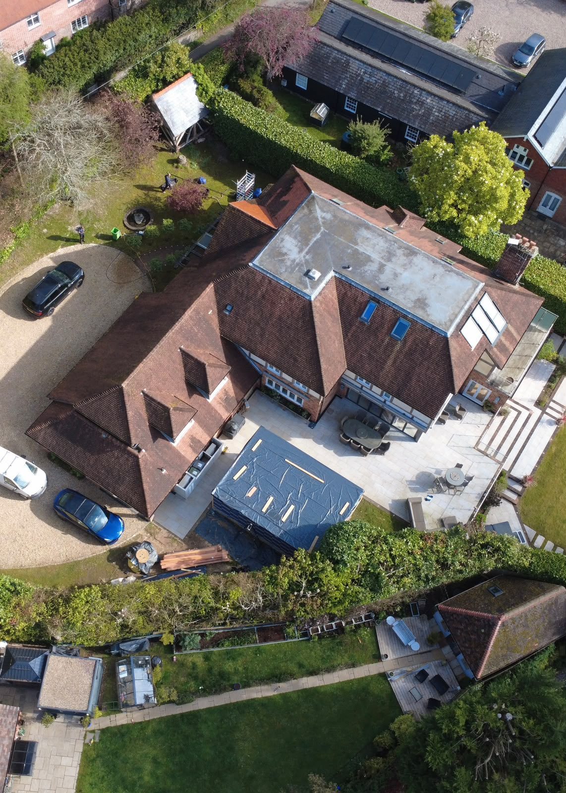 Petersfield-style detached property with clean red tile roof