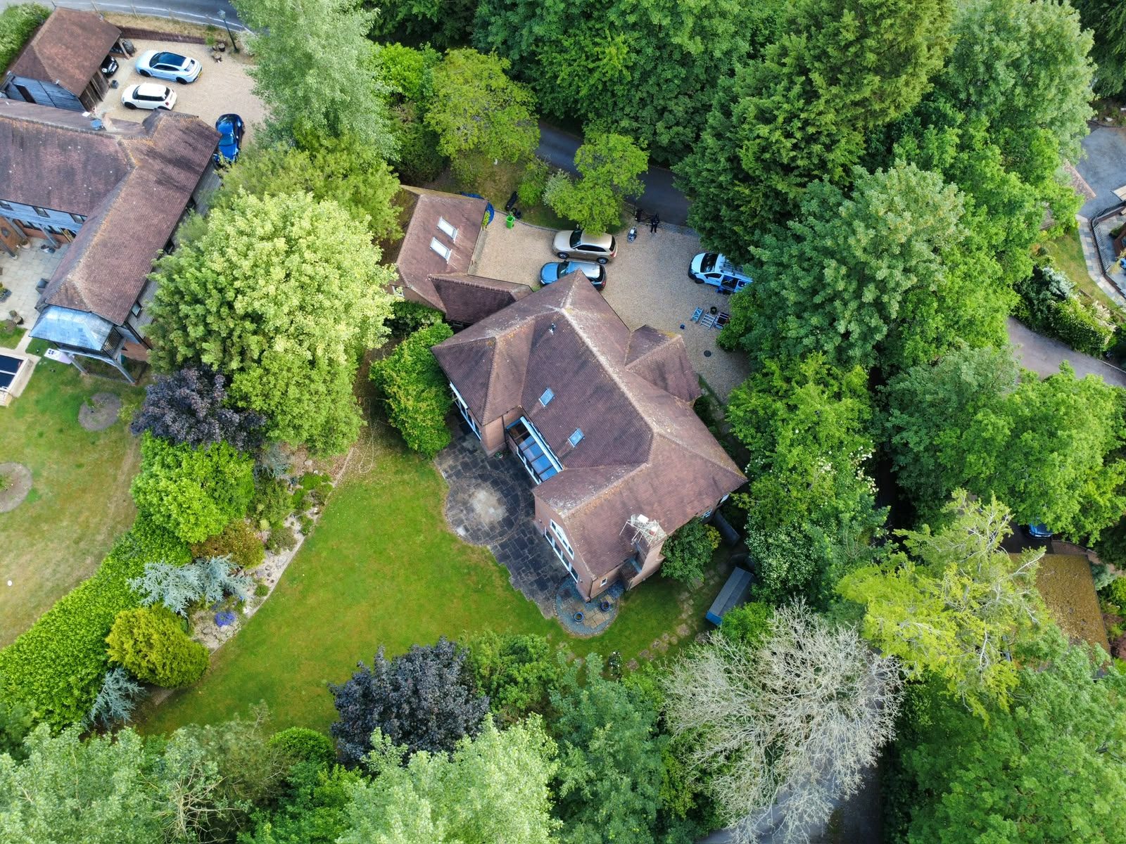The property after cleaning &mdash; executive detached with tile roof, aerial view